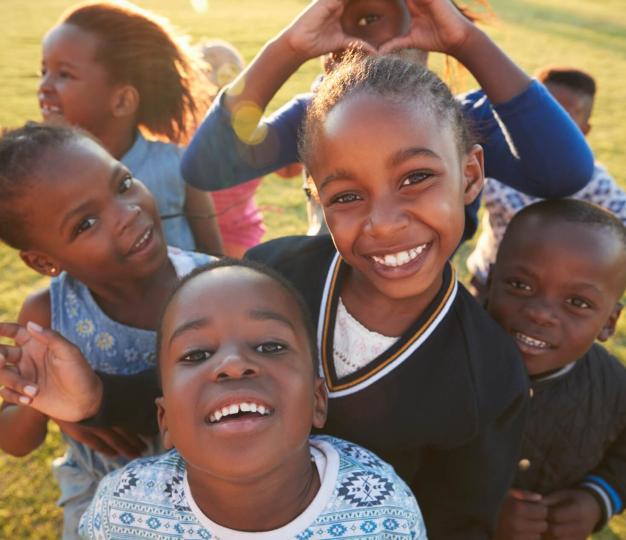 A group of children smiling for the camera.